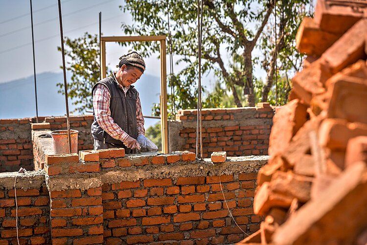 Mason building a wall