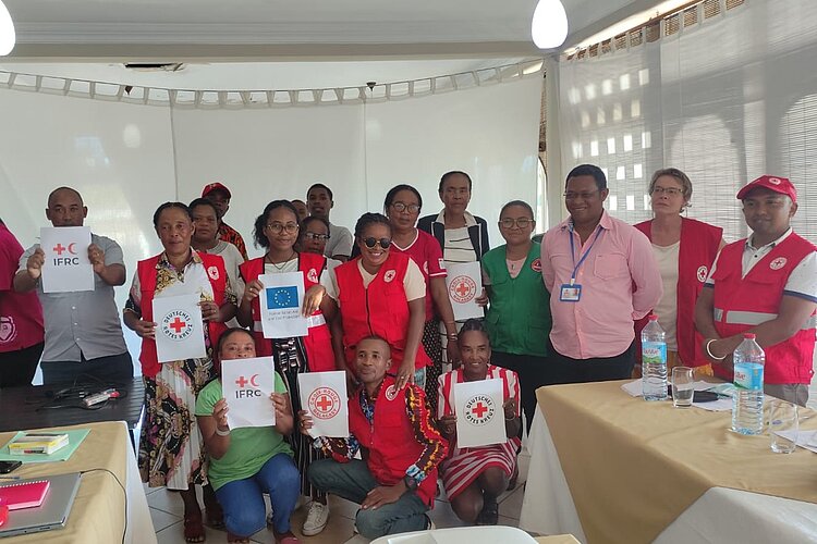 Workshop participants holding certificates