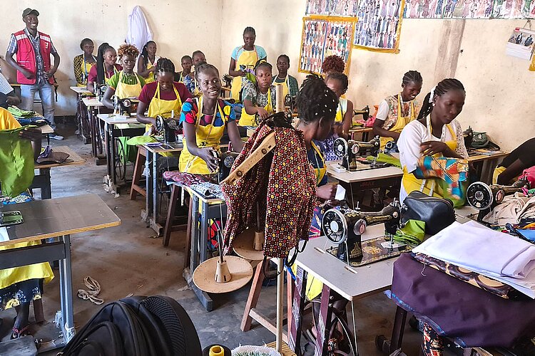 Women training to sew
