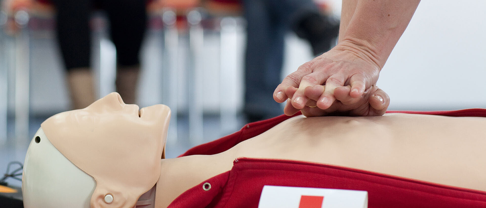 First aid course Heart pressure massage on a doll