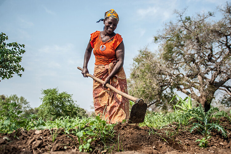 Woman in Mosambique working in garden