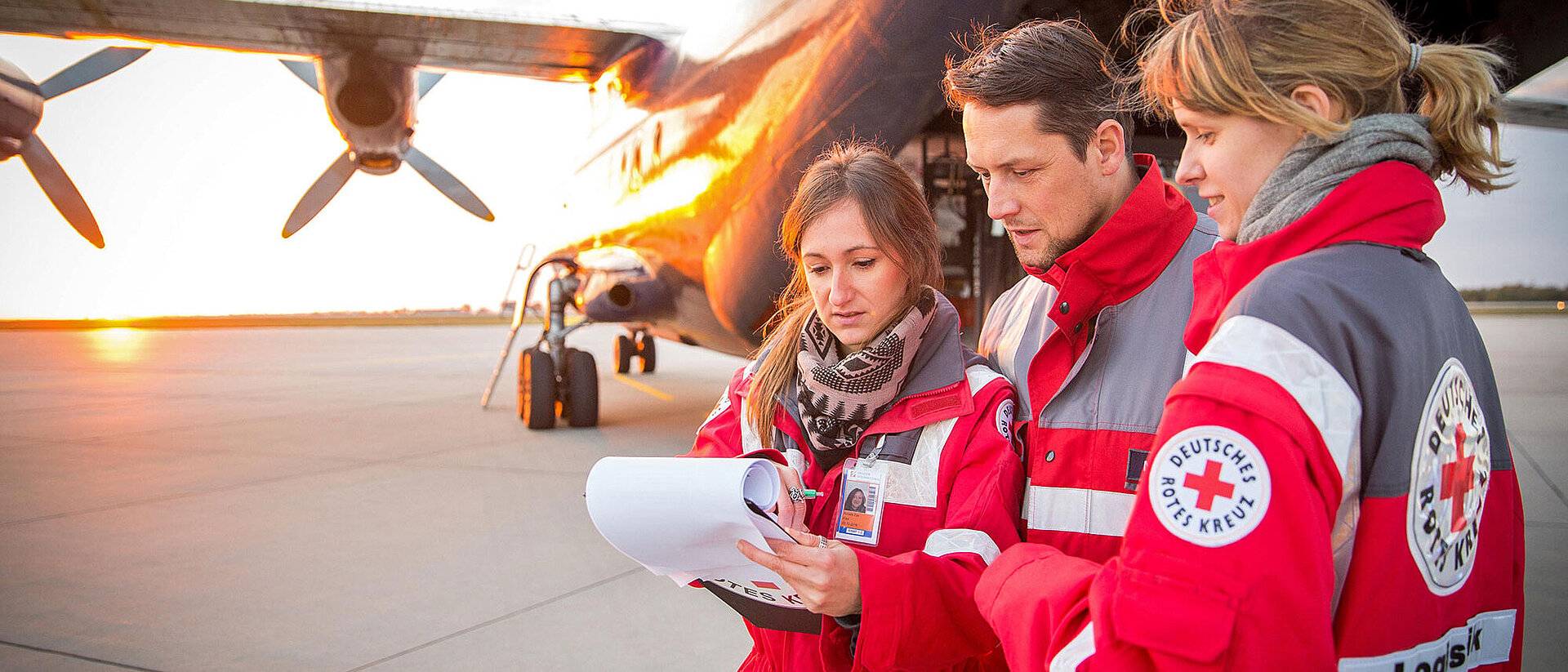 GRC staff talking in front of aircraft