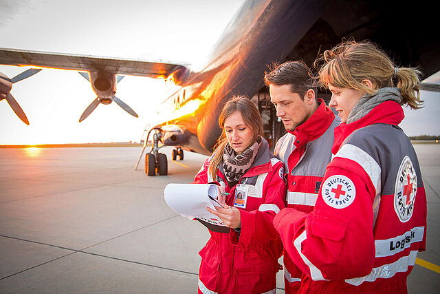 GRC staff talking in front of aircraft