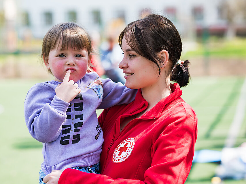 Ukrainian Volunteer Ukrainian Volunteer with child