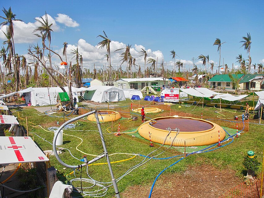 Basins, pumps and equipment on grassland