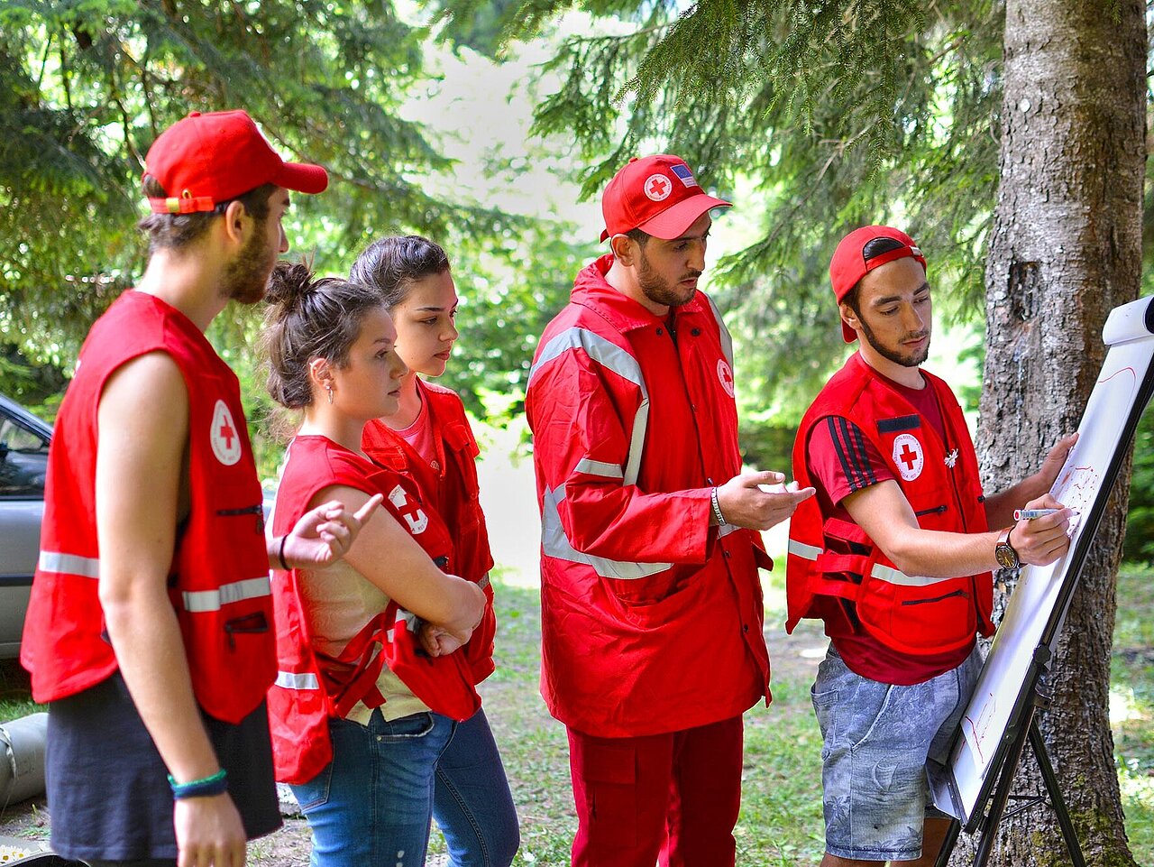 Volunteers in front of flipchart