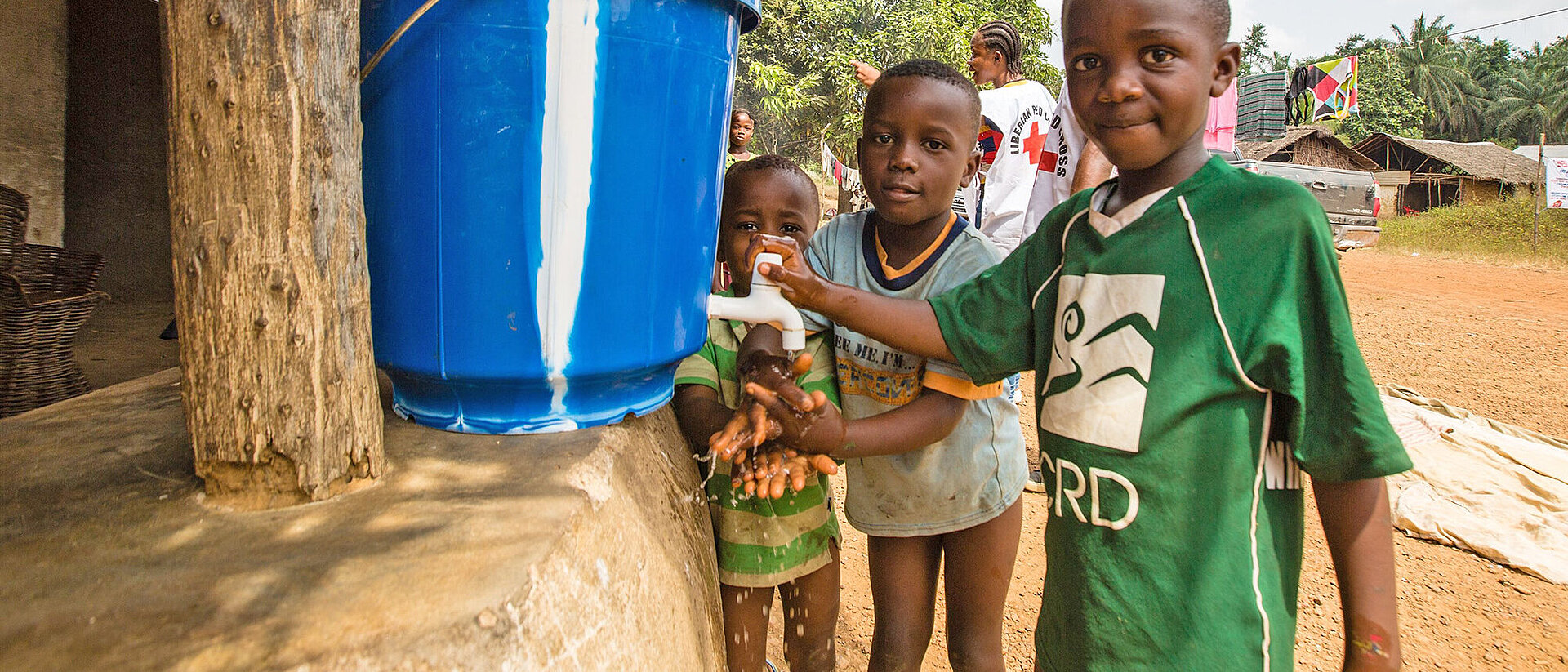 Boys at water dispenser