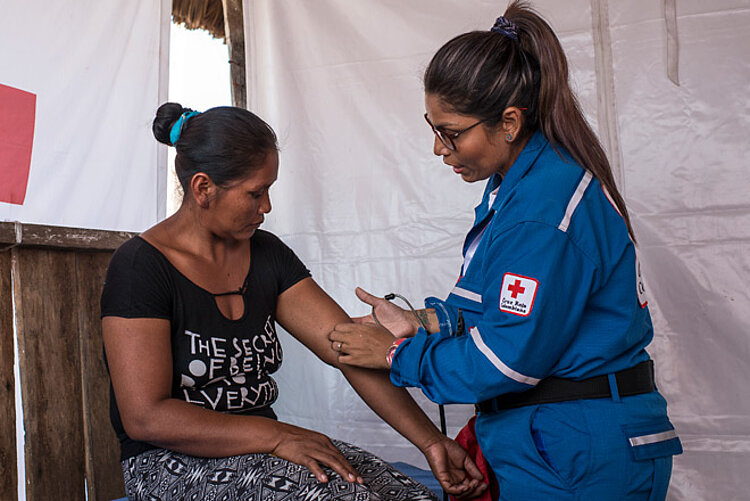 Medical staff examining woman